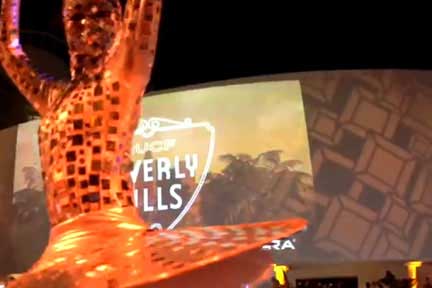 Costumed performer in front of Beverly Hills sign