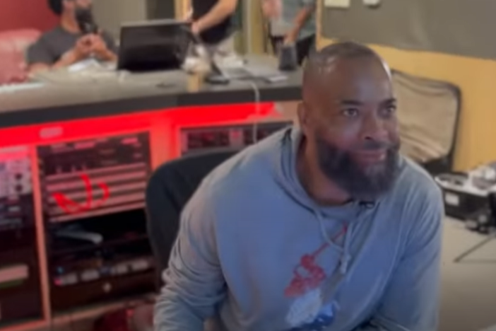 The D.O.C. looking forward at a sound mixing board